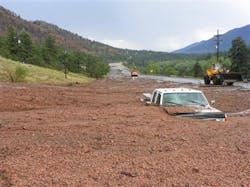 A pickup truck is engulfed by a mudslide on U.S. 24 west of Cascade, Colo. on July 30. A pickup truck is engulfed by a mudslide on U.S. 24 west of Cascade, Colo. on July 30.