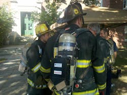 A firefighter location transmitter is fitted to a Worcester firefighter during a technology workshop at Worcester Polytechnic Institute on Aug. 7. A firefighter location transmitter is fitted to a Worcester firefighter during a technology workshop at Worcester Polytechnic Institute on Aug. 7.