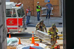 Firefighters move equipment into place near a building at Tyler Perry Studios in Atlanta on Aug. 27. Firefighters move equipment into place near a building at Tyler Perry Studios in Atlanta on Aug. 27.
