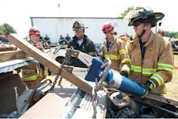 Firefighters participate in a vehicle extrication class at Firehouse Expo 2012.