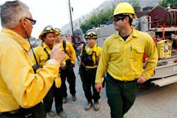 Firefighters get instructions as they ready to head toward a wildfire on Sept. 10 near Wenatchee, Wash. Firefighters get instructions as they ready to head toward a wildfire on Sept. 10 near Wenatchee, Wash.