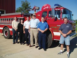The author, fourth from left, visited the Goose Lake Fire Department in Iowa during his 2006 trip. He met with, from left, Randy Novak, director of the Iowa State Training Bureau; Allison Hart, senior staff to Senator Tom Harkin (D-Iowa); Andy McGovern, training officer for the City of Clinton Fire Department; the author, and Training Officer Paul Doyle and Chief Kevin Cain of the Goose Lake Fire Department.