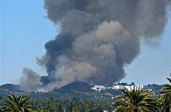 Heavy smoke billows from a wildfire in the hills above the Sepulveda Pass in Los Angeles on Sept. 14. Heavy smoke billows from a wildfire in the hills above the Sepulveda Pass in Los Angeles on Sept. 14.