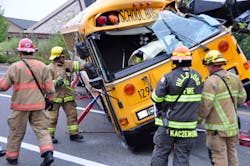 Hillsboro firefighters extricated a school bus driver following wreck with a tractor-trailer carrying a large crane on Sept. 20.