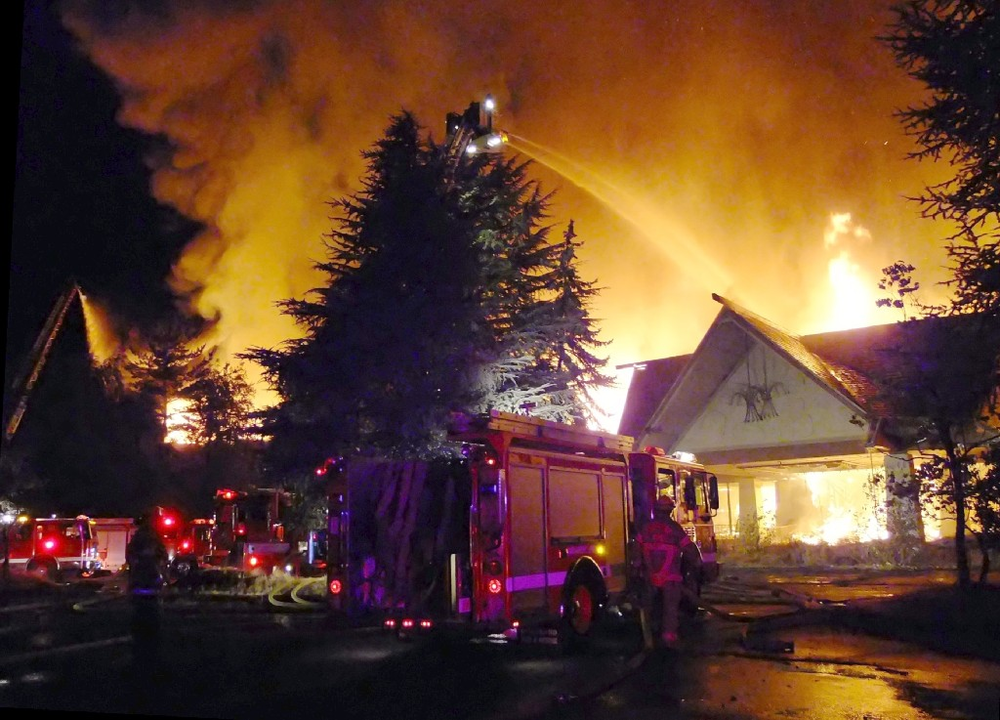 Crews battle a five-alarm fire at the vacant Thunderbird on the River on Hayden Island in Portland, Ore. on Sept. 2.