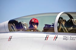 Firefighter Eric Keim gives a thumbs-up signal as his ride aboard a US Air Force Thunderbird F-16 begins. Firefighter Eric Keim gives a thumbs-up signal as his ride aboard a US Air Force Thunderbird F-16 begins.