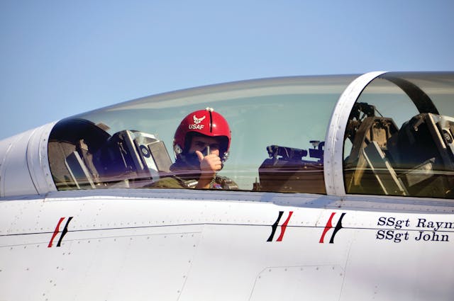 Firefighter Eric Keim gives a thumbs-up signal as his ride aboard a US Air Force Thunderbird F-16 begins.