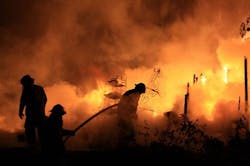 Unionville firefighters are silhouetted against flames billowing from a home near Rover, Tenn. on Sept. 23. Unionville firefighters are silhouetted against flames billowing from a home near Rover, Tenn. on Sept. 23.