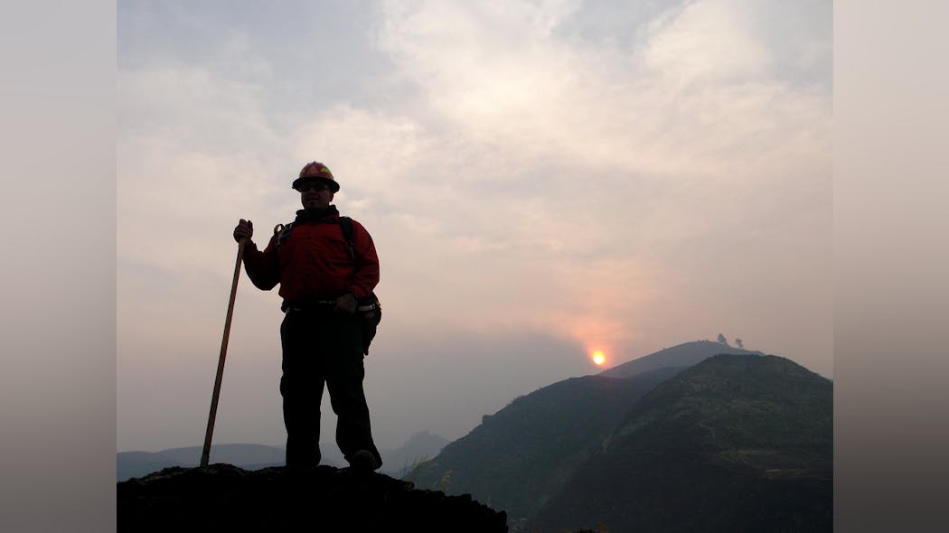 A firefighter is seen digging a fire line at the Sheep Fire in the Nez Perce National Forest on Sept. 16. A firefighter is seen digging a fire line at the Sheep Fire in the Nez Perce National Forest on Sept. 16.
