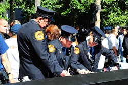 FDNY firefighters are seen at the 9/11 memorial on Sept. 11, 2012.