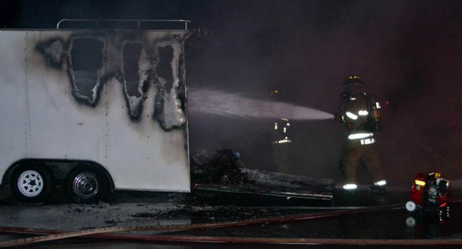 Members of the Northwest Fire District battled a fire after a trailer full of Poore Brothers chips caught fire on Oct. 18.
