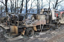 Austrian firefighters battling a wildfire became trapped in their apparatus on Oct. 12 after it became engulfed in flames.