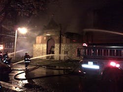 Fire was shooting through the roof of a 125-foot by 125-foot church when Chicago firefighters arrived at the blaze in the Englewood neighborhood on Oct. 26. Fire was shooting through the roof of a 125-foot by 125-foot church when Chicago firefighters arrived at the blaze in the Englewood neighborhood on Oct. 26.