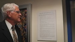 National Fire Academy Superintendent Dr. Denis Onieal looks at a copy of the Code of Ethics on the campus in Emmitsburg, Md. National Fire Academy Superintendent Dr. Denis Onieal looks at a copy of the Code of Ethics on the campus in Emmitsburg, Md.