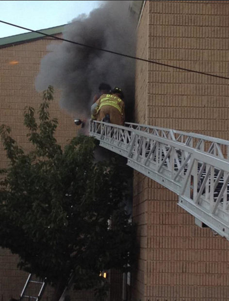 D.C. firefighters from Truck 4 are seen rescuing civilians from a fast moving apartment fire on Oct. 4.
