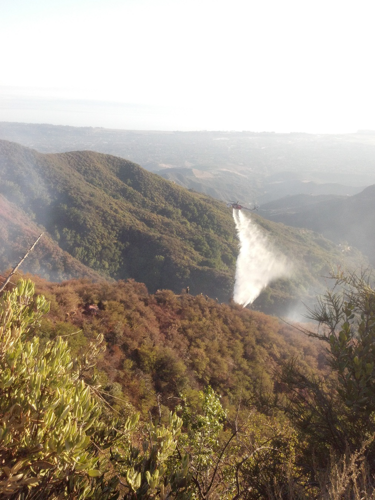 A helicopter drops on hot spots at the Lookout Fire near Santa Barbara, Calif. on Oct. 18.