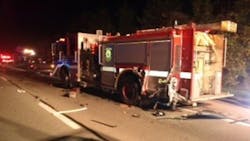 A Miami Township fire engine was struck on a highway late Friday night while it was stopped at the scene of an earlier collision on Oct. 12. A Miami Township fire engine was struck on a highway late Friday night while it was stopped at the scene of an earlier collision on Oct. 12.