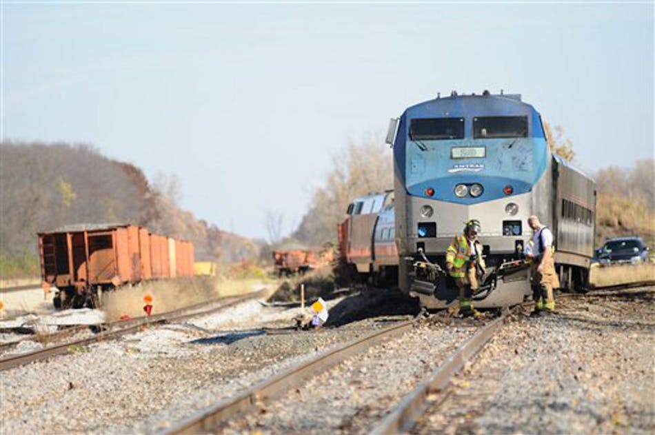 Firefighters inspect the scene of a train derailment just north of Niles, Mich. on Oct. 21.