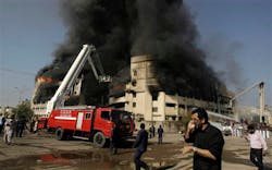 Firefighters extinguish a fire that erupted in a factory in Karachi, Pakistan on Oct. 28. Firefighters extinguish a fire that erupted in a factory in Karachi, Pakistan on Oct. 28.
