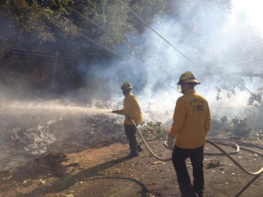 Portland firefighters battled a grass fire across from Heron Lakes Golf course on Oct. 3.