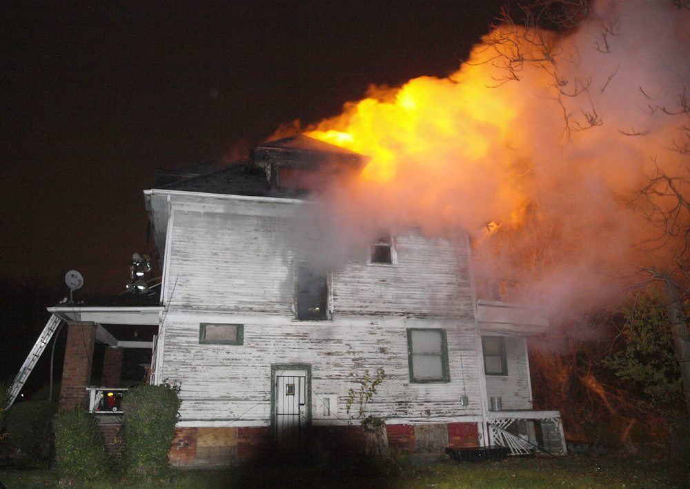 Detroit firefighters are seen battling a house fire during a relatively calm Angels' Night period due to Superstorm Sandy and volunteer efforts.