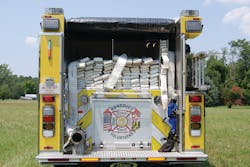 The rear hose bed carries split beds of 3-inch hose, together with a preconnected 2.5-inch attack line and a leader line equipped with a TFT Blitz Fire portable master stream. The rear hose bed carries split beds of 3-inch hose, together with a preconnected 2.5-inch attack line and a leader line equipped with a TFT Blitz Fire portable master stream.