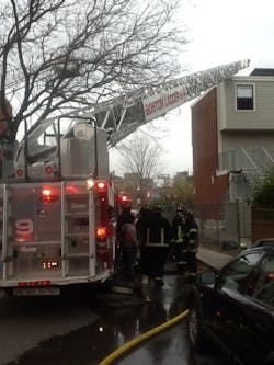 A two-alarm apartment fire in the Boston neighborhood of Charlestown injured a resident and one firefighter on Nov. 7.
