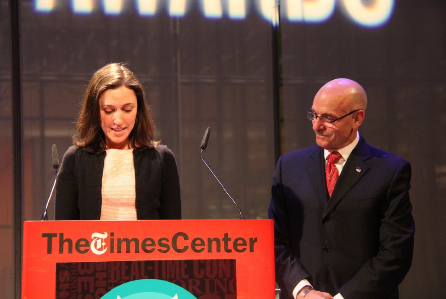 FDNY Social Media Manager Emily Rahimi is seen with Fire Commissioner Salvatore Cassano as they accept the Shorty Award for #LiveSavingHero earlier this year.