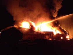 It took more than 100 firefighters from 15 departments to extinguish a four-alarm blaze at a lumber business in Brookline, N.H. on Nov. 1. It took more than 100 firefighters from 15 departments to extinguish a four-alarm blaze at a lumber business in Brookline, N.H. on Nov. 1.