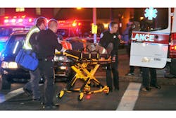 An injured firefighter is taken to an ambulance following a blast in Springfield An injured firefighter is taken to an ambulance following a blast in Springfield