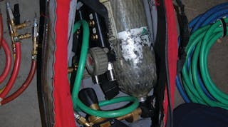 Photo 1 - You don&apos;t want to be left unable to complete the operation because equipment was left on the apparatus. This bag contains an air bottle, fittings, control panel, hoses and more.