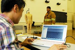 Huiju Park, assistant professor in the Department of Fiber Science and Apparel Design, records data during testing for a project to design better-fitting turnout gear. Huiju Park, assistant professor in the Department of Fiber Science and Apparel Design, records data during testing for a project to design better-fitting turnout gear.