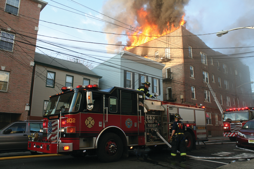 DEC. 3: UNION CITY, NJ &ndash; Firefighters found heavy fire coming from the top floor of an occupied four-story mixed-use building. Approximately 20 people escaped the fire, but nearly 100 residents were displaced. As crews advanced on the fire, the roof collapsed. Ladder pipes, a squirt and a tower ladder from Jersey City responded to the third alarm.