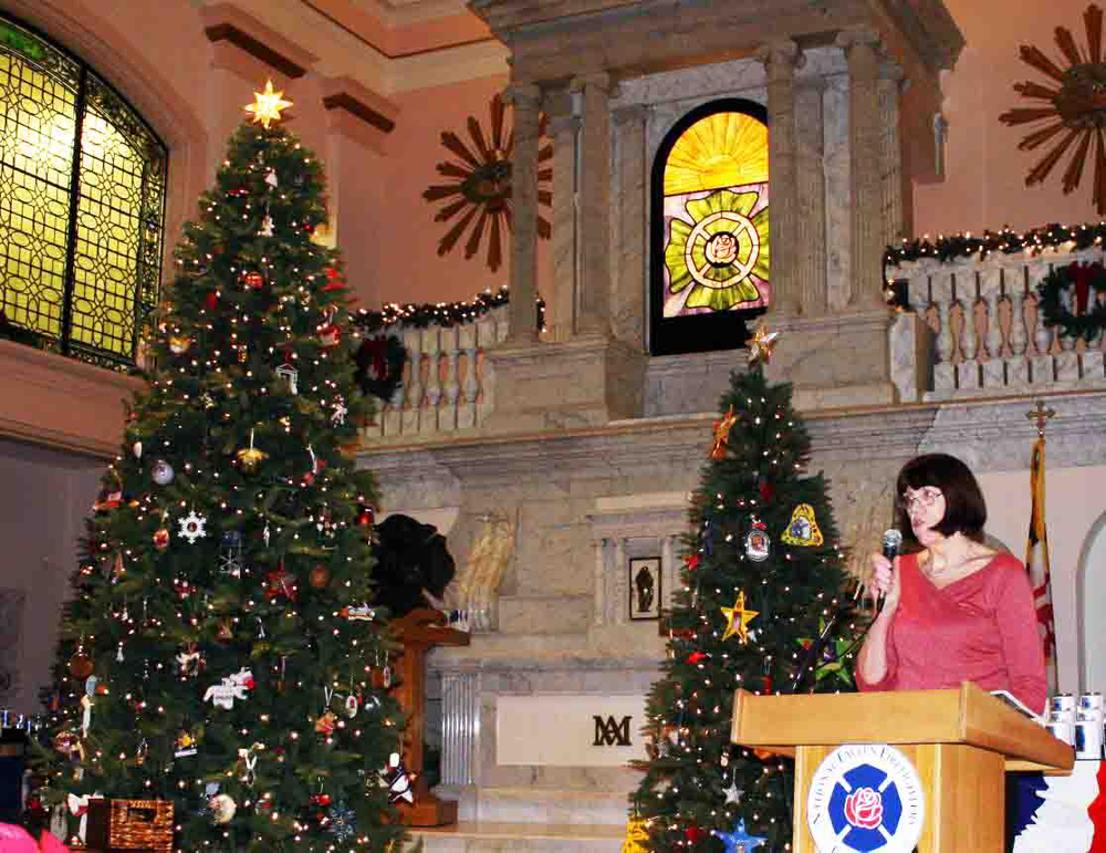 Jane Neville, mother of Brian Neville, a Maryland paramedic/firefighter, speaks to the crowd during the ceremony.