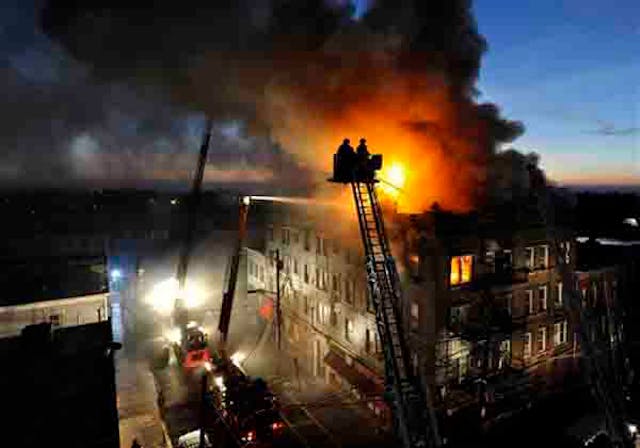 Firefighters from North Hudson Regional Fire and Rescue and the Jersey City Fire Department battle the flames, Monday, Dec. 3, 2012 in Union City, N.J.