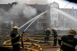 Firefighters battle a of fire Monday, Dec. 10, 2012, in Philadelphia. Fire Department Executive Chief Richard Davison says the blaze broke out Monday afternoon at a three-story industrial garage. Davison says an elderly woman has been taken to the hospital in stable condition. The woman's injuries were not immediately clear. Firefighters battle a of fire Monday, Dec. 10, 2012, in Philadelphia. Fire Department Executive Chief Richard Davison says the blaze broke out Monday afternoon at a three-story industrial garage. Davison says an elderly woman has been taken to the hospital in stable condition. The woman's injuries were not immediately clear.