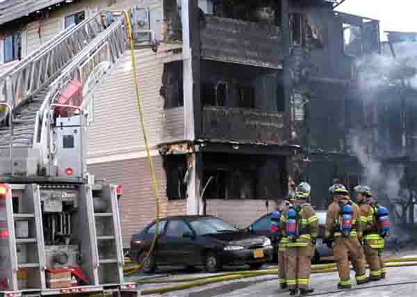 Anchorage firefighters battle a blaze at a three-story apartment building on Thursday, Jan. 3, 2013, in midtown Anchorage, Alaska. Officials said two people were injured and up to 45 people displaced in the fire at the Calais Arms apartments.