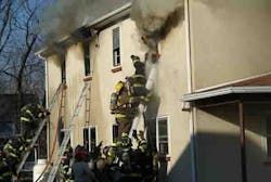 Two firefighters were forced to bail out of a second-story window during an apartment fire in Delaware due to deteriorating conditions.