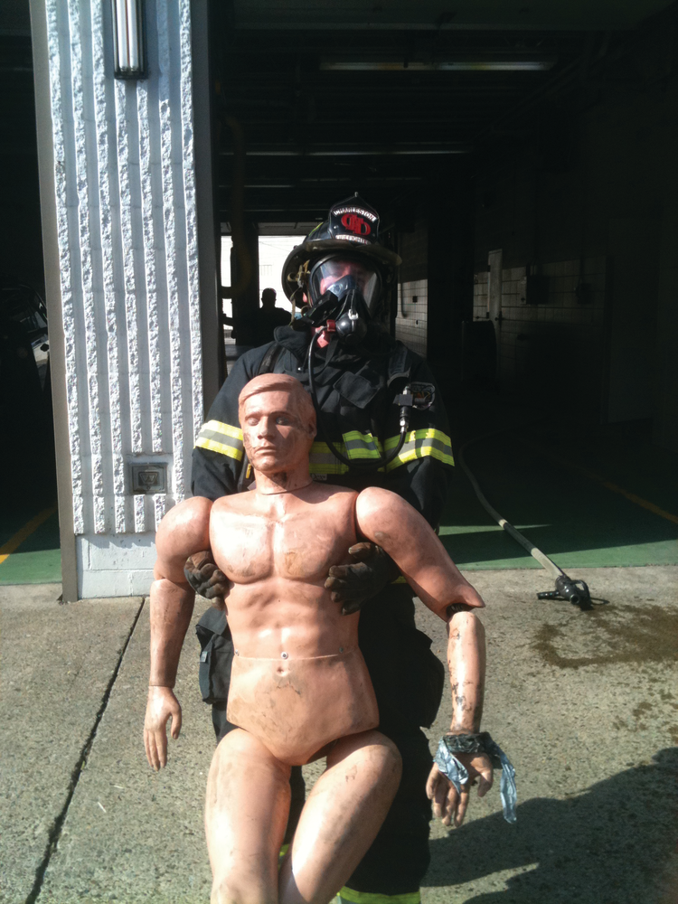 You don't need expensive props or training buildings to create effective training. Using a rescue maniquine in the parking lot of the station, these firefighters train on tactics and fitness.