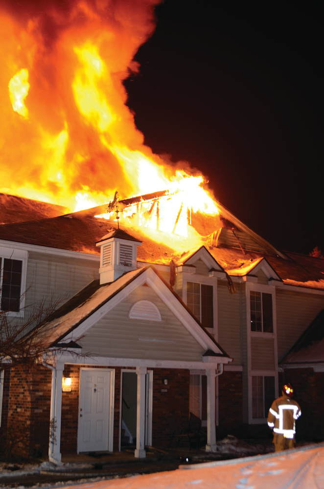 Crews battled a two-alarm fire at a large, two-story townhouse complex in Madison Heights, MI