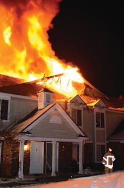 Crews battled a two-alarm fire at a large, two-story townhouse complex in Madison Heights, MI