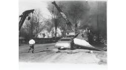 Parts of tank car 83013, burning propane and other debris were scattered over a wide area. One piece of the tank car was propelled 330 feet by the explosion. Noise and blast pressure from the explosion were felt several blocks from the scene.