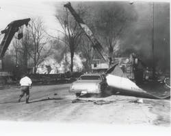 Parts of tank car 83013, burning propane and other debris were scattered over a wide area. One piece of the tank car was propelled 330 feet by the explosion. Noise and blast pressure from the explosion were felt several blocks from the scene.