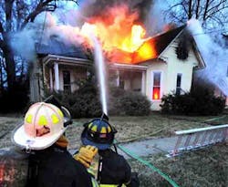 Owensboro Fire Department firefighter battle a blaze that destroyed a vacant home Tuesday, Jan. 1, 2013, in Owensboro, Ky.