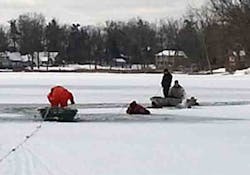 In this photo provided by the Waterford Regional Fire Department, firefighters from Rescue 2 work the scene where two adult men fell through the ice on Scott Lake in Waterford, Mich., on Tuesday, Jan. 1, 2012. One man was hospitalized, and a firefighter sustained a hand injury. In this photo provided by the Waterford Regional Fire Department, firefighters from Rescue 2 work the scene where two adult men fell through the ice on Scott Lake in Waterford, Mich., on Tuesday, Jan. 1, 2012. One man was hospitalized, and a firefighter sustained a hand injury.