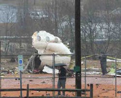 Part of the fuselage of an airplane rests on a softball field where it crashed, in Burlington, N.C., Wednesday, Jan. 16, 2013. Assistant Police Chief Chris Verdeck said that 57-year-old David Gamble of Greensboro died when his plane came down around 6 a.m. Wednesday about 5 miles northeast of the Burlington-Alamance Regional Airport. The plane was a Pilatus PC-12 owned by Labcorp, a medical testing company in Burlington. A spokeswoman with the Federal Aviation Administration says the plane was heading to Morristown, N.J. Part of the fuselage of an airplane rests on a softball field where it crashed, in Burlington, N.C., Wednesday, Jan. 16, 2013. Assistant Police Chief Chris Verdeck said that 57-year-old David Gamble of Greensboro died when his plane came down around 6 a.m. Wednesday about 5 miles northeast of the Burlington-Alamance Regional Airport. The plane was a Pilatus PC-12 owned by Labcorp, a medical testing company in Burlington. A spokeswoman with the Federal Aviation Administration says the plane was heading to Morristown, N.J.