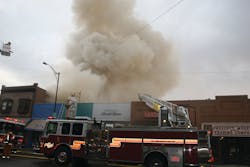 Prescott Fire Department Truck 72 performs roof operations during the early stages of the Whiskey Row fire. Crews were quickly removed from roof operations as command prepared for a defensive operation. Prescott Fire Department Truck 72 performs roof operations during the early stages of the Whiskey Row fire. Crews were quickly removed from roof operations as command prepared for a defensive operation.