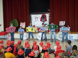 Members of the Johnson County Rural Fire Department #1 Fire Corps team help with fire prevention education at a local school. Members of the Johnson County Rural Fire Department #1 Fire Corps team help with fire prevention education at a local school.