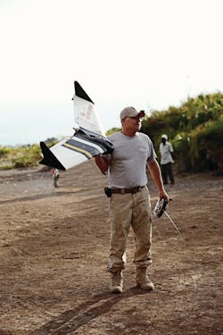 Gene Robinson of RP Flight Systems demonstrates a Spectra unmanned aerial vehicle (UAV) in Africa. The Spectra line is designed to be deployed to scenes of natural disasters, primarily for search and recovery.