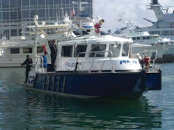 San Diego Harbor Police Department Marine 2 maneuvers into dock after a training mission during Firehouse World last month. The walk around cabin offers easy access around the craft.